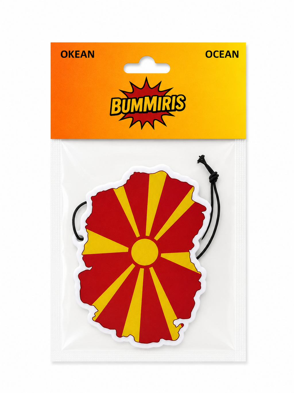 Bummris Ocean air freshener in a clear plastic bag with a bright orange and yellow header card. The product is a die-cut sticker shaped like the map of Macedonia, featuring a red and yellow sunburst pattern with a black hanging string.